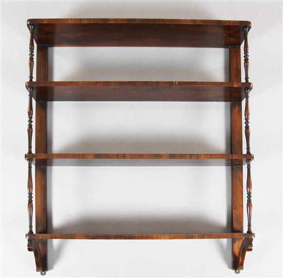 A Regency rosewood four tier wall shelf, W.2ft 9in. D.6in. H.3ft 3in.